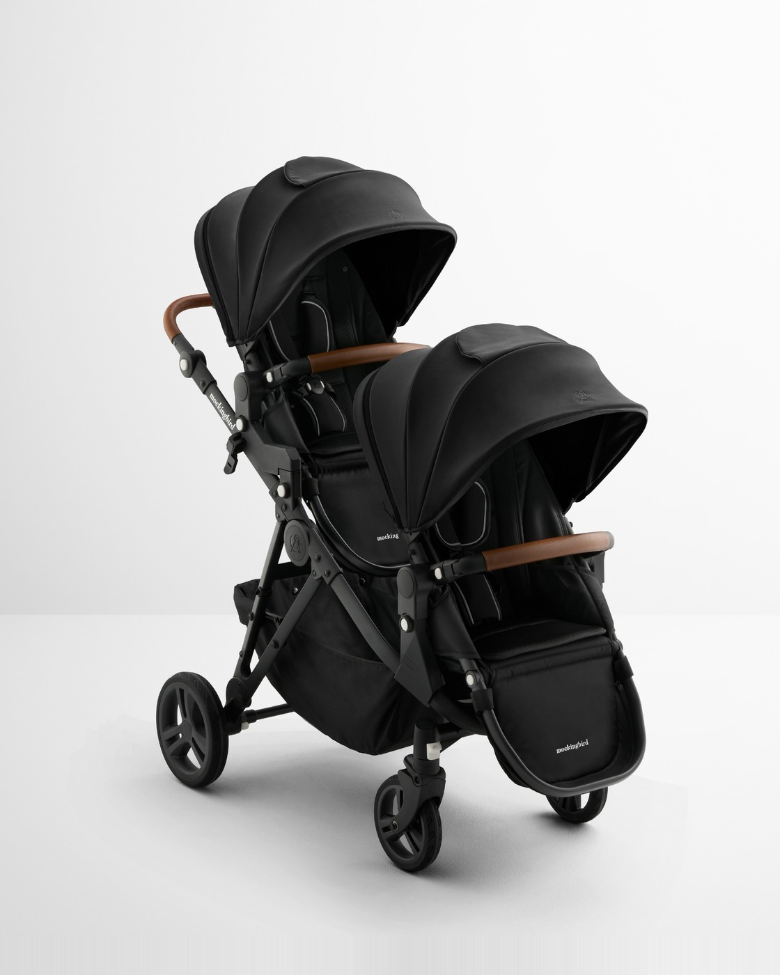The Mockingbird Single-to-Double Stroller 3.0 in black, photographed in a plain studio.