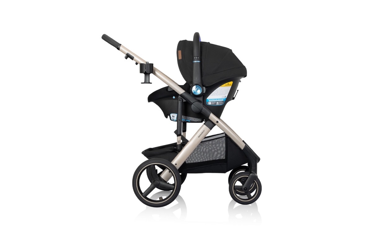 The Evenflo Monarch Travel System in Space Black: a black full-size stroller on a champagne frame with the LiteMax NXT infant car seat clicked in.