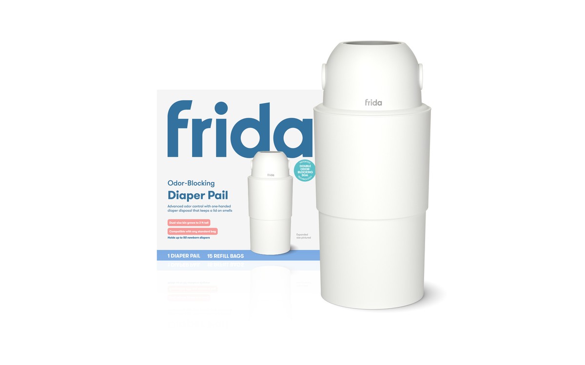 The Frida Odor-Blocking Diaper Pail, a white two-part pail with a domed lid, standing next to its carton.