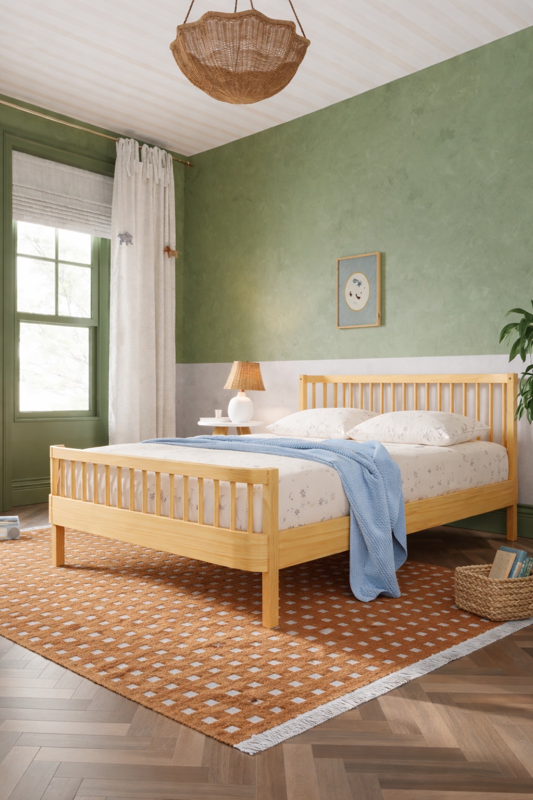 The Nestig Wave Full Bed in natural wood, made up with white bedding and a blue throw, in a green-walled bedroom with a woven pendant light.