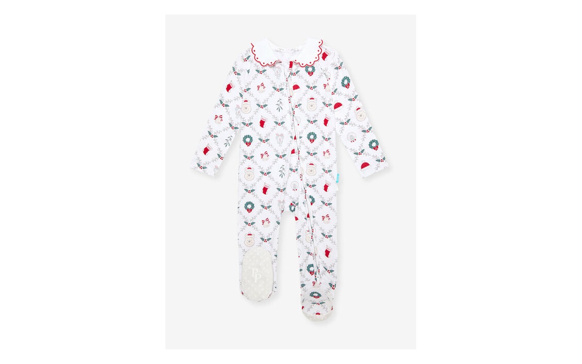 A Posh Peanut Holiday Pooh footie one piece in white with a small red and green Winnie the Pooh print, photographed flat on a plain background.