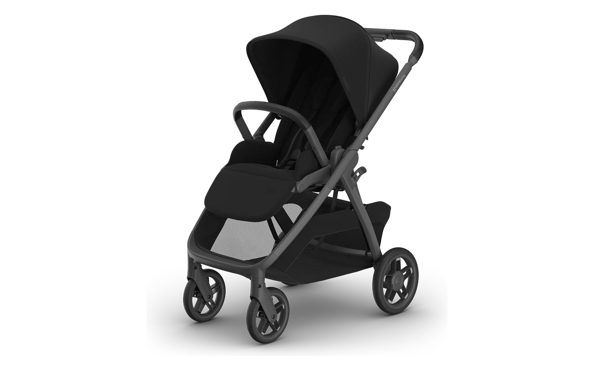 The UPPAbaby Kona stroller in James, black fabric on a carbon frame, three-quarter view on white.