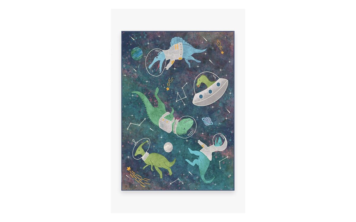 The Ruggable Dinosaurs in Space washable rug, dinosaurs in spacesuits on a deep blue starfield, photographed flat from above.